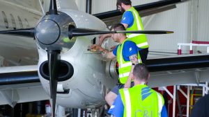Aircraft Mechanics Working on a Saab 340